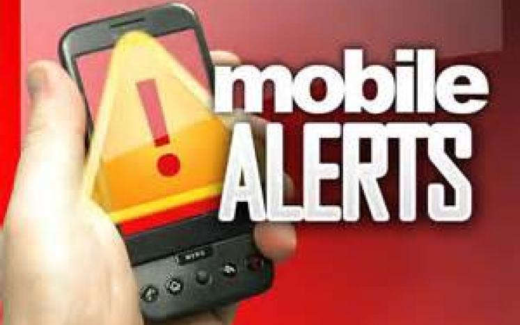 Drawing of hand holding smartphone with large exclamation point on it - with words "Mobile Alerts"