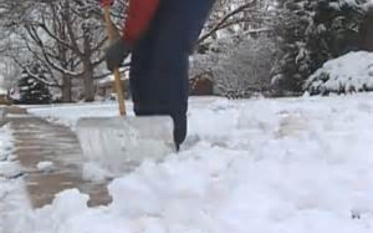 Photo of person shoveling snow